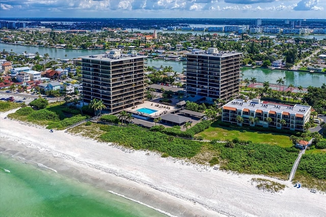 birds eye view of property featuring a water view and a city view