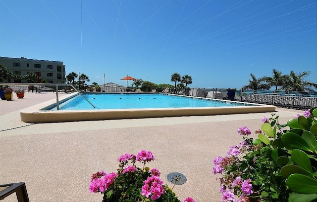 view of swimming pool featuring a patio area