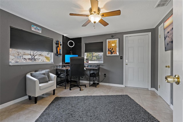 home office with light tile patterned flooring and ceiling fan