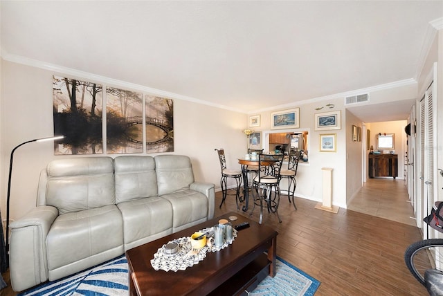 living room featuring ornamental molding and hardwood / wood-style floors