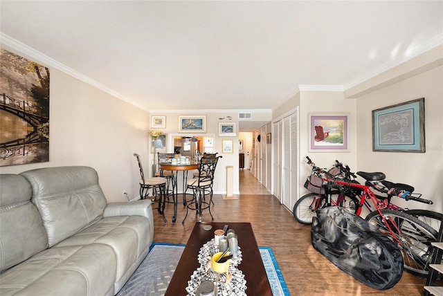 living room featuring hardwood / wood-style floors and ornamental molding