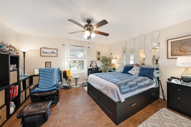 bedroom featuring light hardwood / wood-style floors and ceiling fan