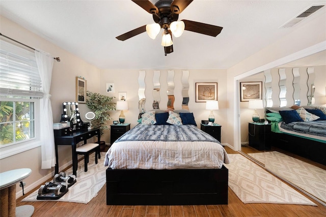 bedroom featuring ceiling fan and light hardwood / wood-style flooring