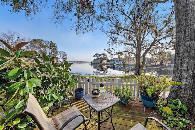 wooden deck with a water view