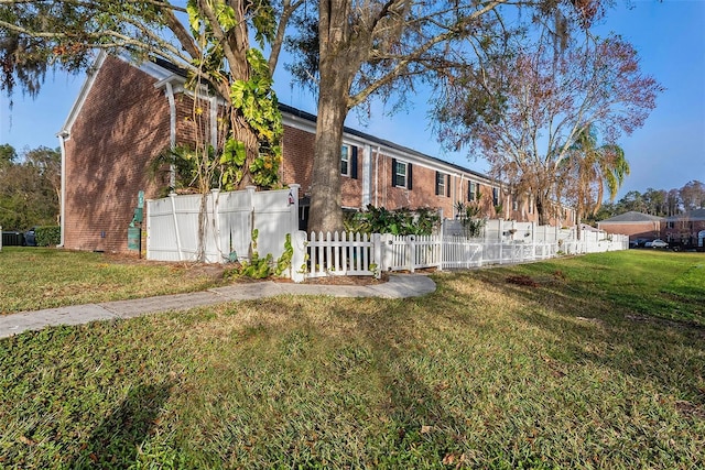 view of property exterior with a yard