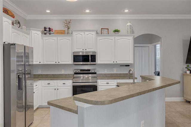 kitchen featuring appliances with stainless steel finishes, white cabinetry, sink, a kitchen island with sink, and light tile patterned floors