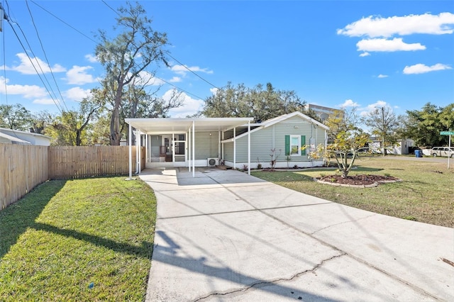 bungalow-style house featuring a carport and a front yard