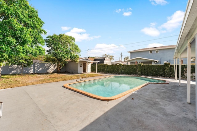 view of pool with a patio area, a fenced backyard, and a fenced in pool