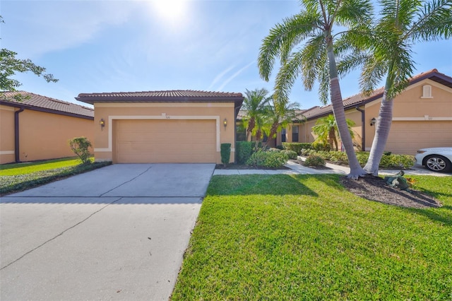 view of front of property with a garage and a front lawn