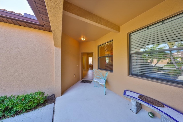 property entrance featuring a patio