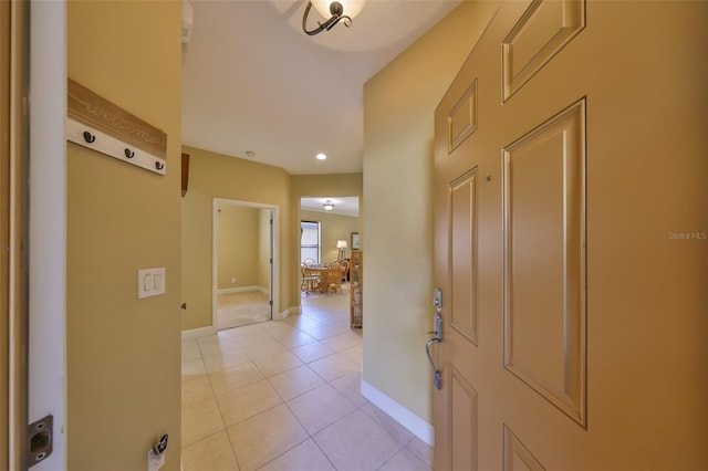 hallway with light tile patterned floors