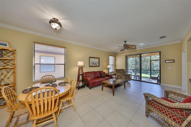 living room featuring crown molding, light tile patterned floors, and ceiling fan