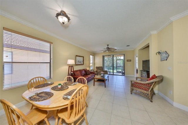 dining room featuring light tile patterned floors, ornamental molding, and ceiling fan