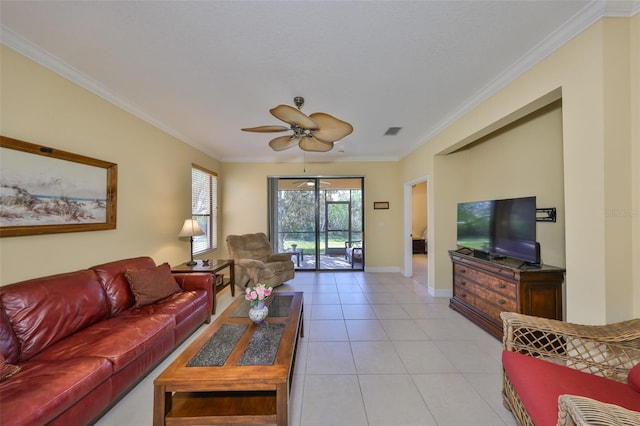 living room with light tile patterned floors, crown molding, and ceiling fan