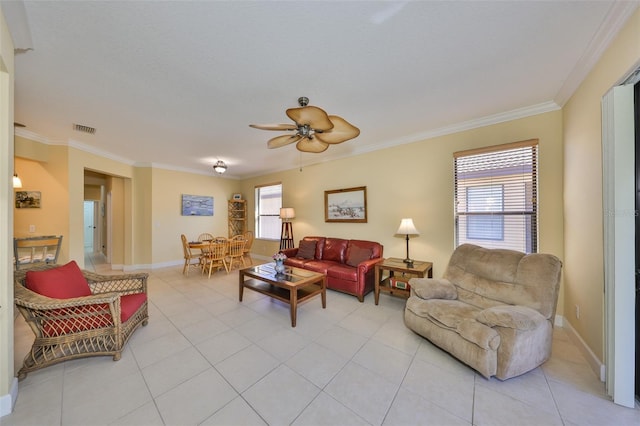 living room featuring ornamental molding, a wealth of natural light, and light tile patterned floors