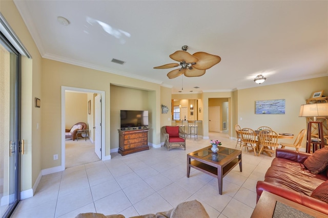 living room featuring light tile patterned floors, crown molding, and ceiling fan