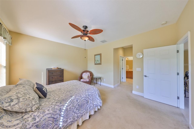 bedroom with ceiling fan and light carpet