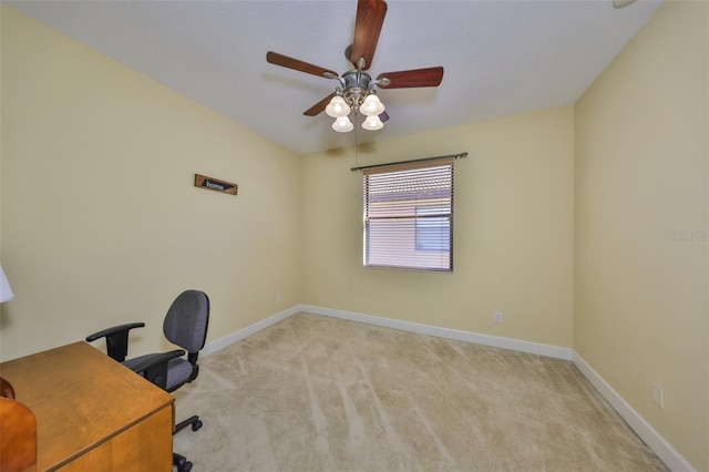 unfurnished office featuring light carpet and ceiling fan