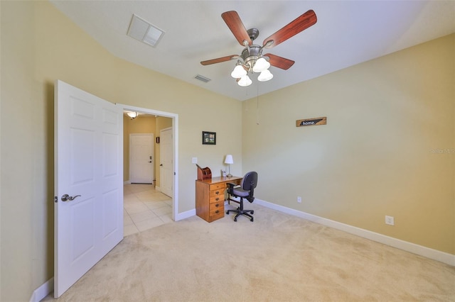 carpeted office space featuring ceiling fan