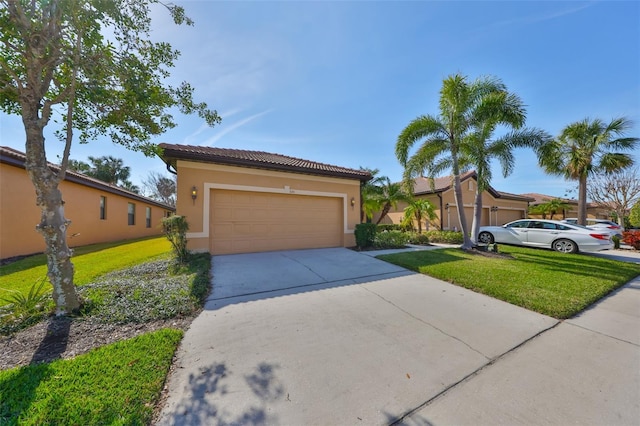 view of front of home featuring a garage and a front yard