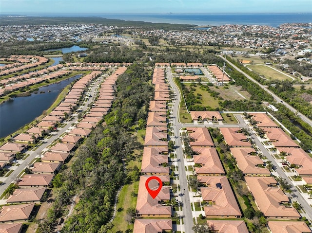 birds eye view of property featuring a water view