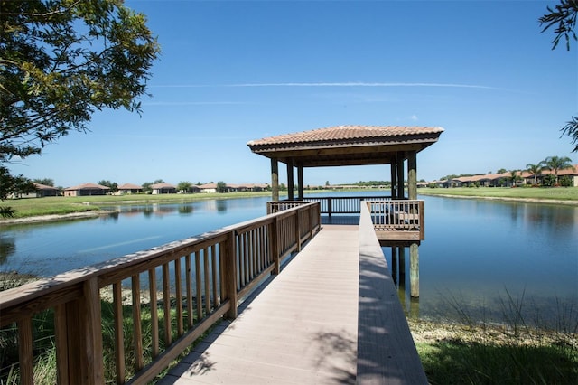 dock area with a gazebo and a water view