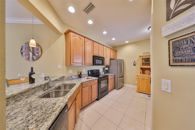 kitchen with pendant lighting, sink, light tile patterned floors, light stone counters, and black appliances