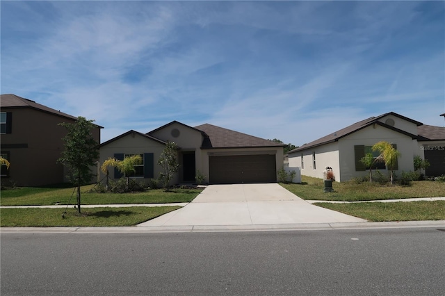 ranch-style home with a garage and a front lawn