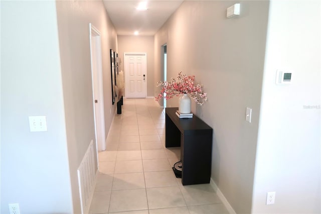 corridor with light tile patterned floors