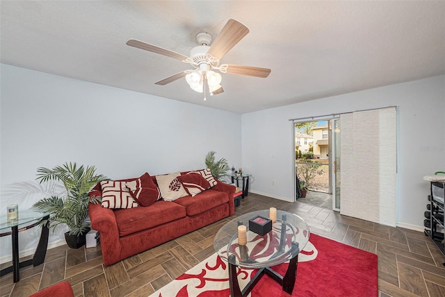 10944 Keys Gate Dr, Riverview, FL 33579 - living room featuring ceiling fan, a textured ceiling, and dark parquet floors