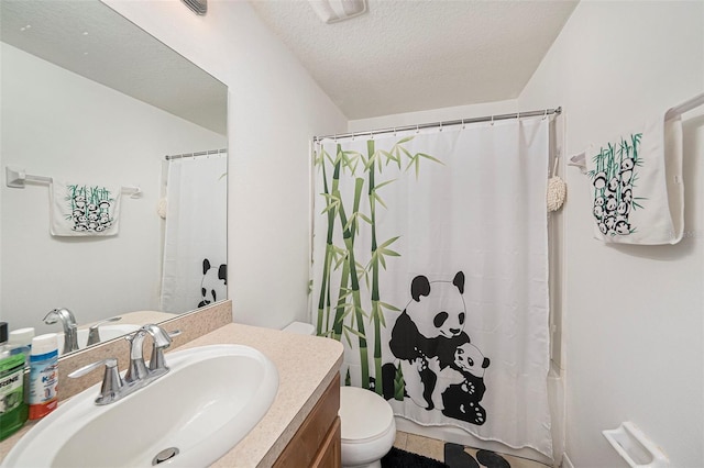 10944 Keys Gate Dr, Riverview, FL 33579 - bathroom featuring vanity, a textured ceiling, and toilet