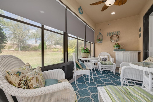 sunroom with ceiling fan