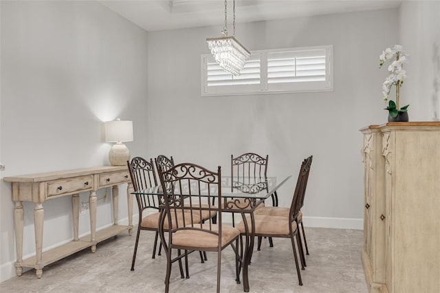 dining space featuring a notable chandelier