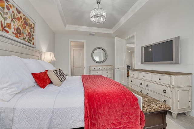 bedroom with a chandelier, crown molding, and a raised ceiling