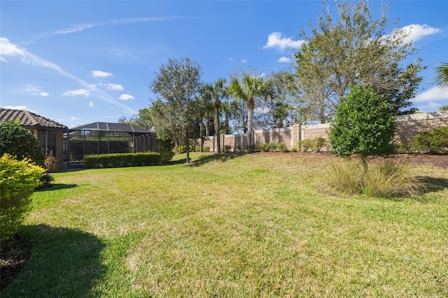 view of yard with a lanai