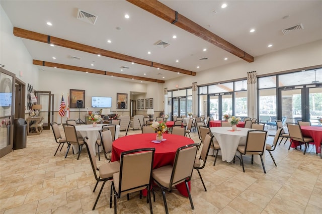 dining room featuring french doors and beamed ceiling