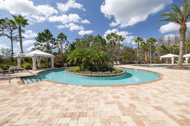 view of pool with a patio and a gazebo