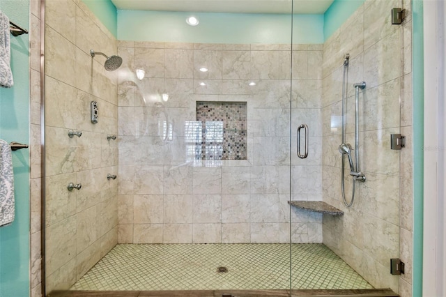 bathroom with a shower with shower door