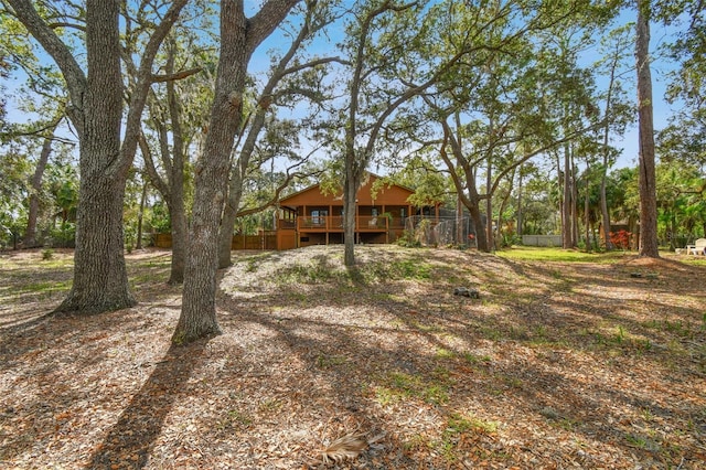 view of yard featuring a wooden deck