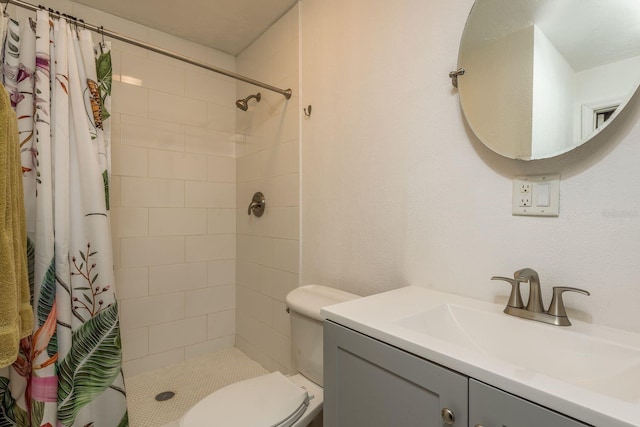 bathroom with vanity, toilet, and a shower with shower curtain