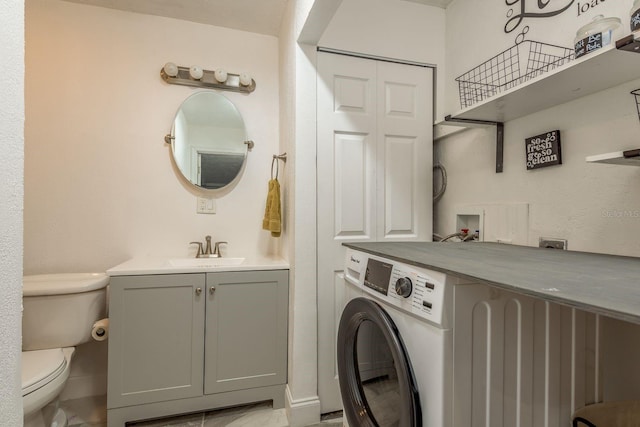 laundry room with washer / clothes dryer and sink