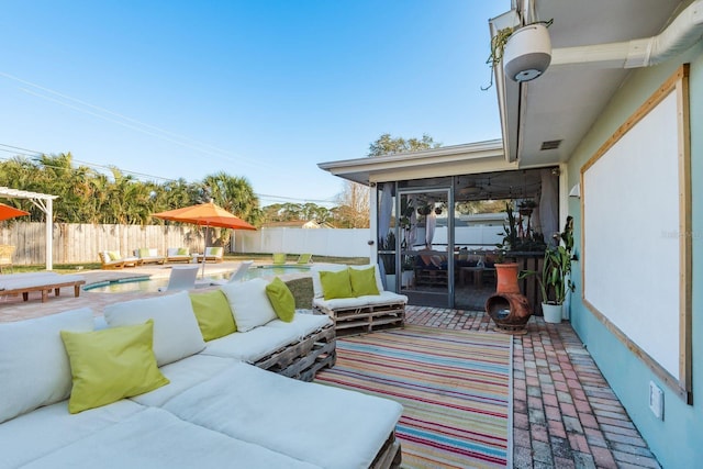 view of patio featuring a fenced in pool and outdoor lounge area