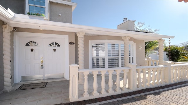 15701 Springmoss Ln, Tampa, FL 33624 - entrance to property with a chimney and a porch