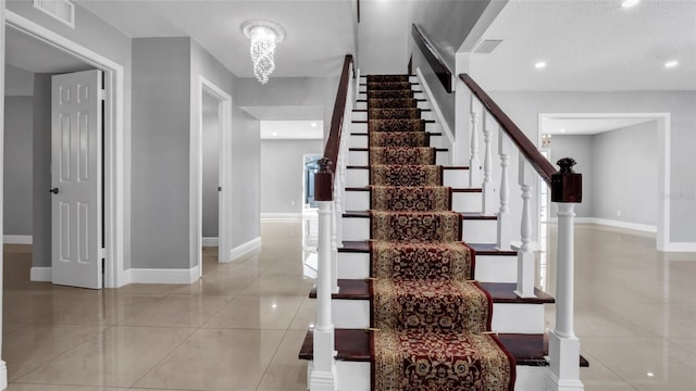 15701 Springmoss Ln, Tampa, FL 33624 - stairs with tile patterned floors, baseboards, and recessed lighting
