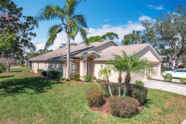 ranch-style house featuring a garage, central AC, and a front lawn