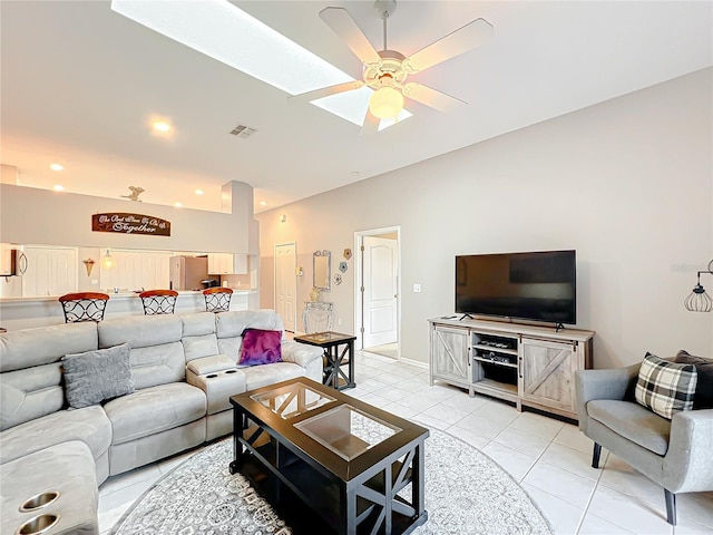 tiled living room with ceiling fan