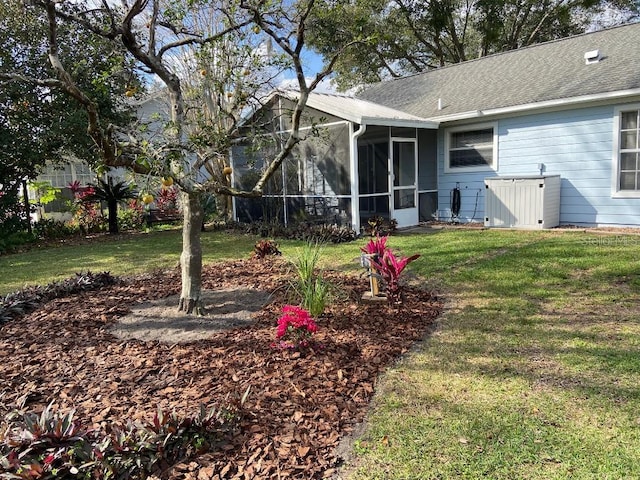 view of yard featuring a sunroom