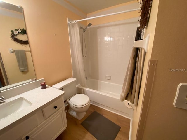 full bathroom with shower / tub combo, vanity, wood-type flooring, and toilet