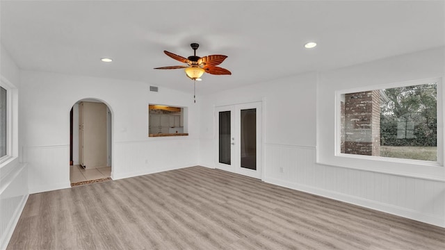 spare room featuring ceiling fan and light wood-type flooring