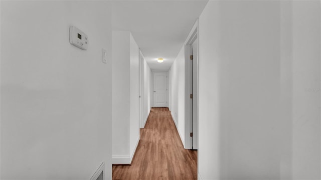 hallway featuring light hardwood / wood-style flooring